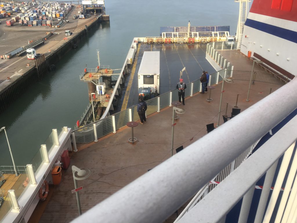 Trucks rolling in the containers on board the ferry
