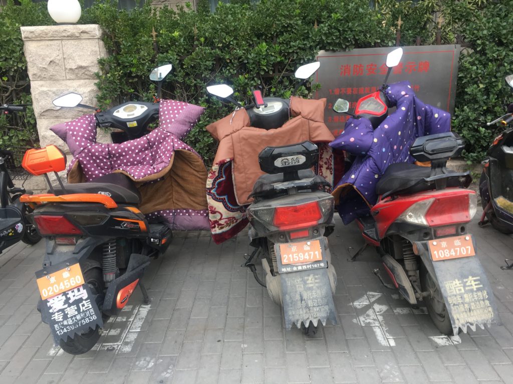 Little quilted jackets for your scooter to keep your hands warm and quell the oncoming breeze