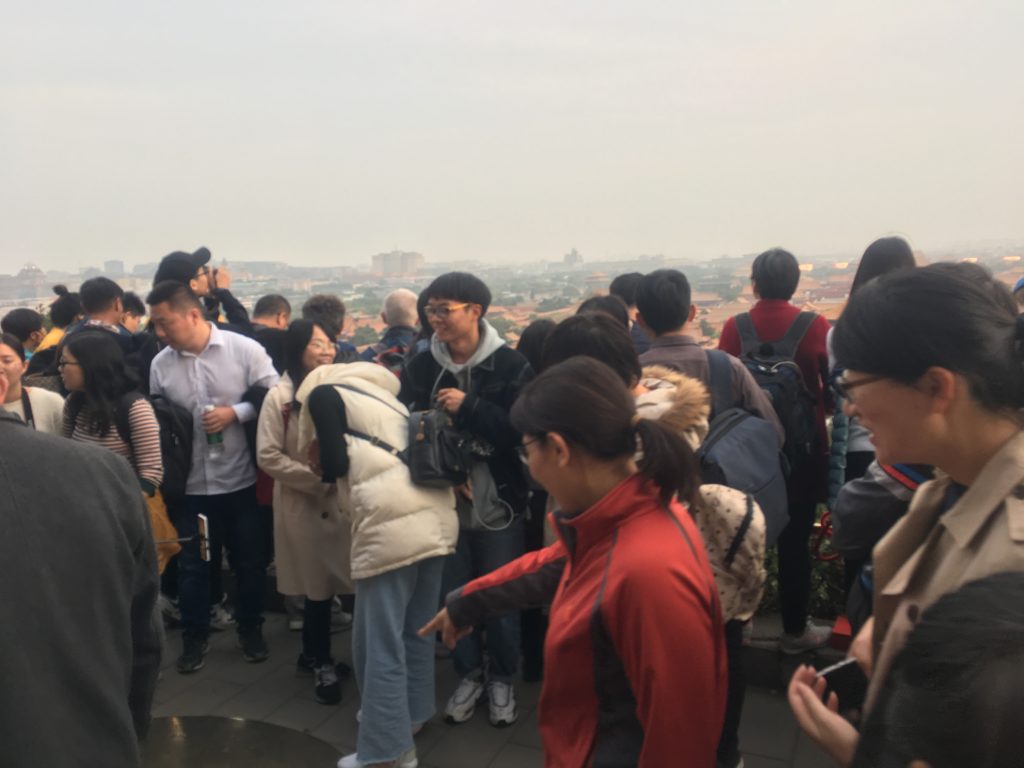 Some of my tourist friends look at the centre point of Beijing